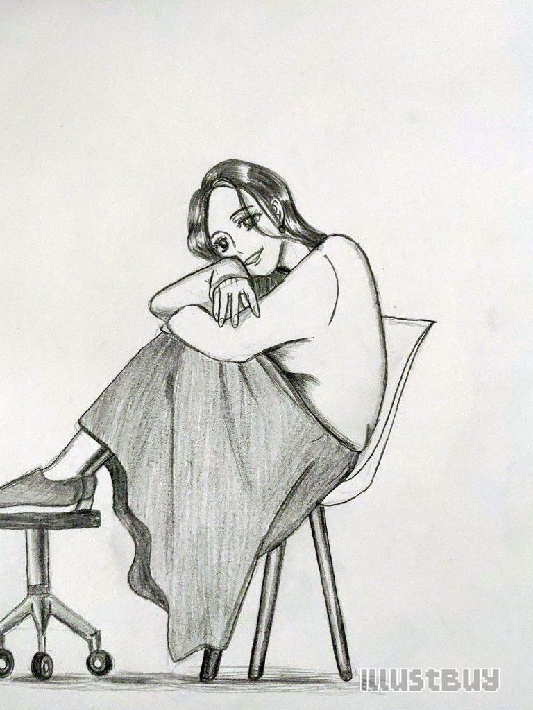 A side view of a girl holding her knees 