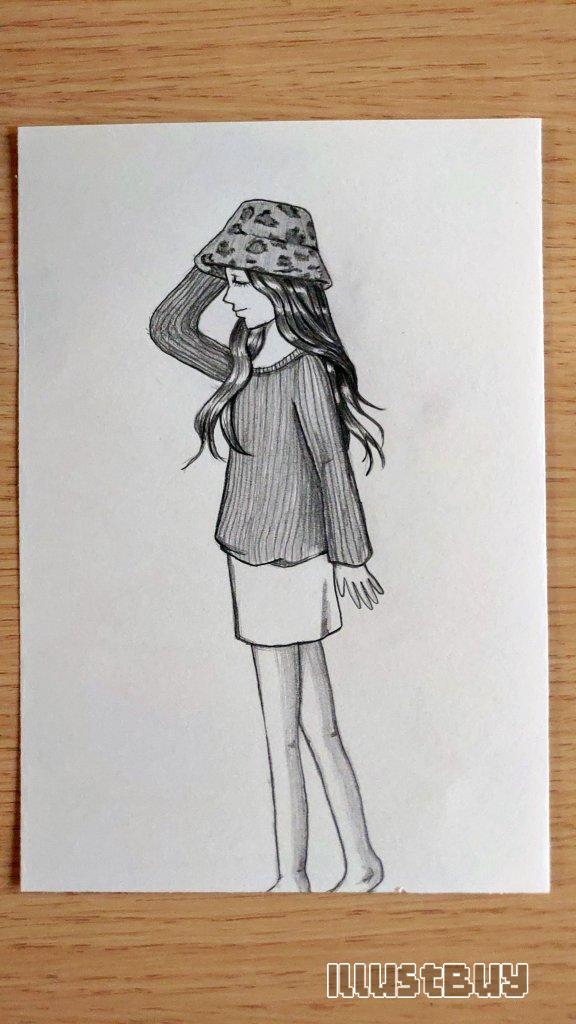 A girl wearing a leopard bucket hat